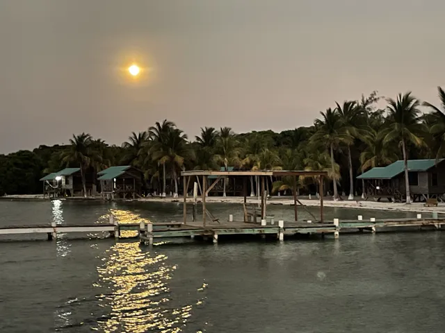 Moonlit island waterfront — Isla Marisol Resort, Belize